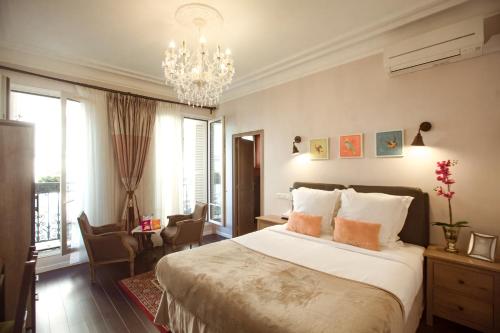 Postel nebo postele na pokoji v ubytování La Maison Gobert Paris Hotel Particulier