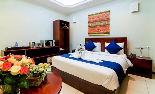 Katil atau katil-katil dalam bilik di Tanzanite Executive Suites