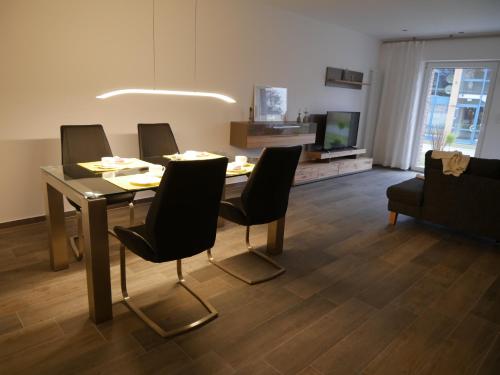 Una televisión o centro de entretenimiento en Apartment Haltern