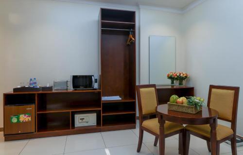 Televisyen dan/atau pusat hiburan di Tanzanite Executive Suites