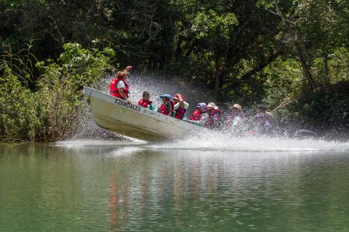 a group of people in a boat on the water at Las Guacamayas Lodge, Selva Lacandona, Chiapas México in Tlatizapán