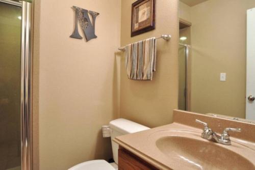 a bathroom with a sink and a toilet at Windrow Retreat in New Braunfels
