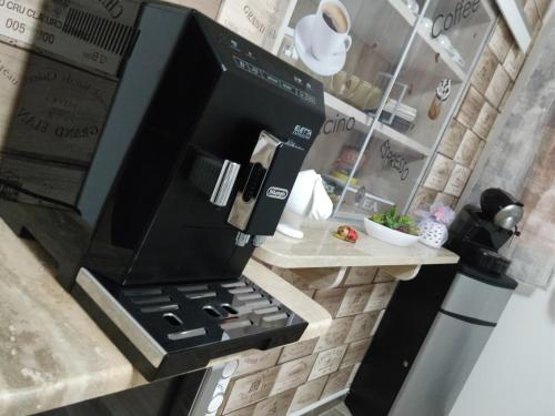 a kitchen with a microwave and a stove at La Bella Vita in San Vito dei Normanni
