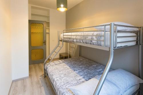 a bedroom with a bunk bed in a room at La Casa nel Borgo in Bergamo