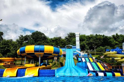 a water park with a bunch of slides in the water at Dubrava Guest House in Loo