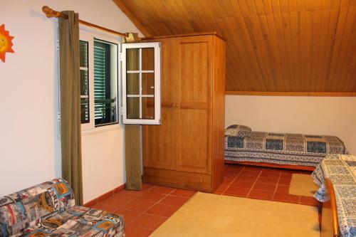 a living room with a bunk bed and a couch at Casa dos Caseiros in Santa Cruz