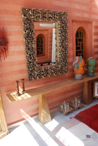 a doll house with a mirror on the wall at Casa Taos in Marrakech