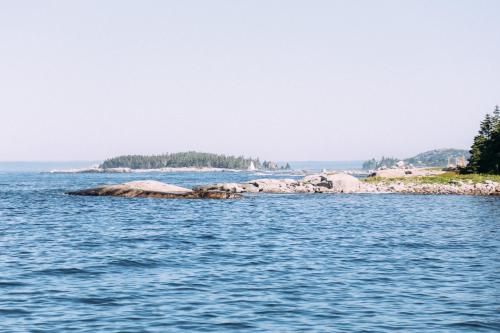 an island in the middle of the water at Sand Dollar in Peggy's Cove