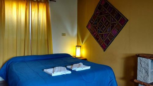 En eller flere senge i et værelse på El Mundo Interior