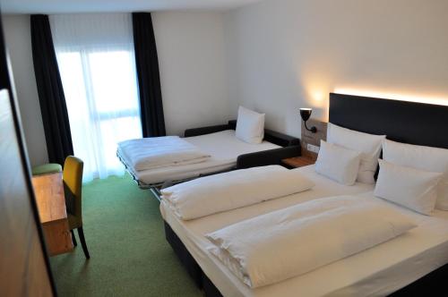 Un ou plusieurs lits dans un hébergement de l'établissement Alb Inn - Hotel & Apartments
