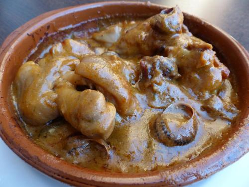 a brown bowl of food on a table at Hostal Vall D'Aneu by Arcas & Sambola in Esterri d'Àneu