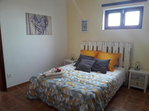 a bedroom with a large bed in a room at Casa Chona in Tinajo