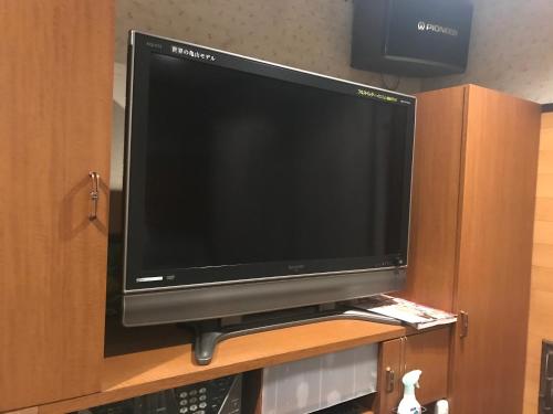 a flat screen tv sitting on top of a cabinet at Hotel Vegas (Adult Only) in Sapporo