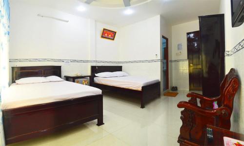 Postel nebo postele na pokoji v ubytování Phuong Hue Hotel