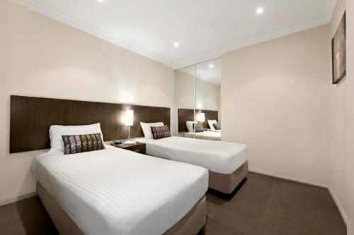 Una cama o camas en una habitación de Quest Singleton