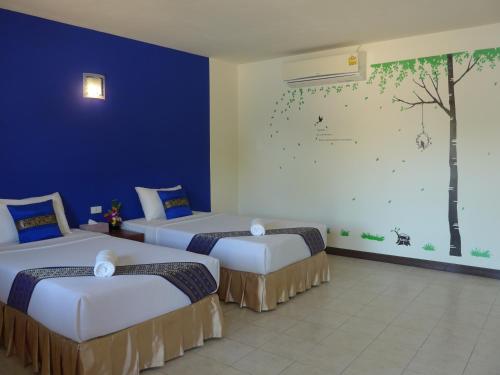 Säng eller sängar i ett rum på Forum House Hotel Krabi