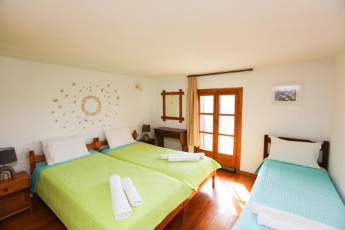 Postel nebo postele na pokoji v ubytování Villa Marigo