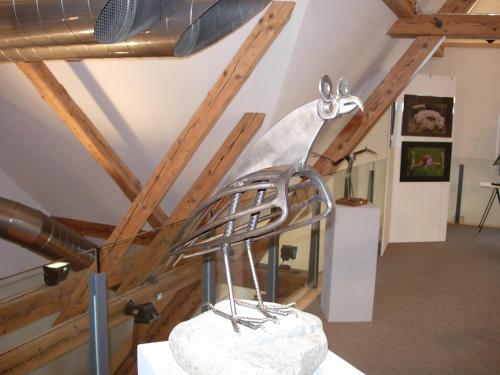 a metal sculpture of a pair of scissors at Hotel Bären in Sumiswald