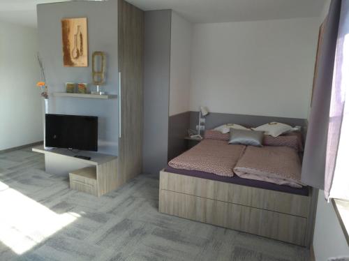 Posteľ alebo postele v izbe v ubytovaní Business Apartments