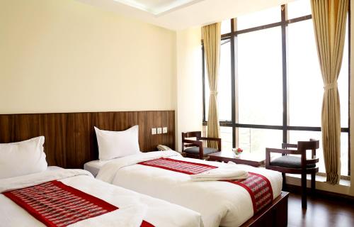 Hotel Kathmandu Innにあるベッド