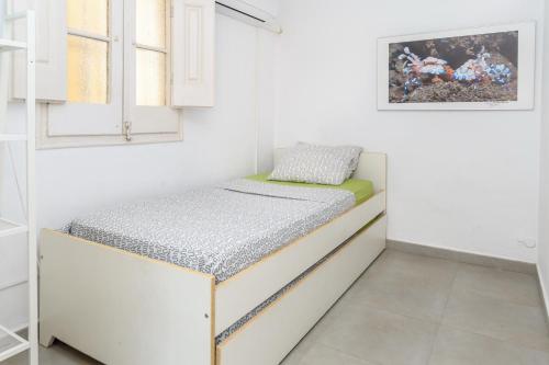 เตียงในห้องที่ Private Roof Top Sant Antoni
