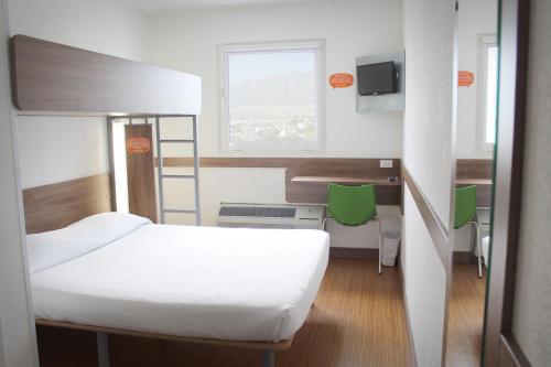 Postel nebo postele na pokoji v ubytování Hotel Hi! Queretaro