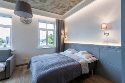 Un pat sau paturi într-o cameră la 9010 Apartments