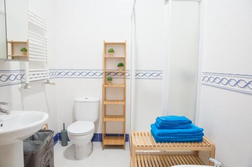 a bathroom with a toilet and a sink at Rent4Rest - Lisbon Downtown Designer's Apartment in Lisbon