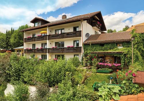 a large house with a garden in front of it at Haus Carola in Bodenmais