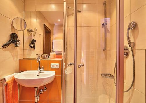 a bathroom with a sink and a shower at Haus Carola in Bodenmais