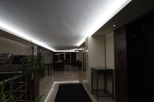a room with a hallway with a light on the ceiling at Yalihan Ari Hotel in Unye