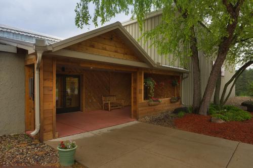 a porch of a house with a patio at Tamarack Wisconsin Dells, a Ramada by Wyndham in Wisconsin Dells