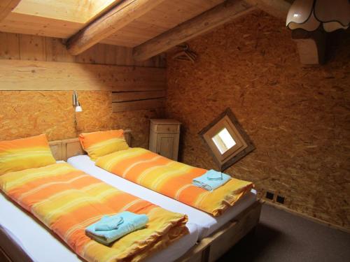 A bed or beds in a room at Gässlihof