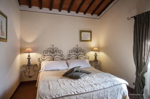 Un pat sau paturi într-o cameră la Tenuta Il Burchio