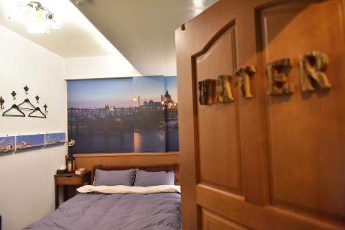 Ένα ή περισσότερα κρεβάτια σε δωμάτιο στο 123 Cheers Hostel