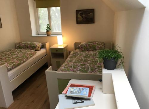 Кровать или кровати в номере Willi Ohler Haus