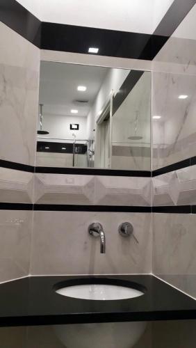a bathroom with a sink and a mirror at da Benedetta in Monterosso al Mare
