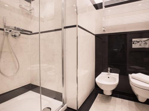 a bathroom with a shower and a toilet and a sink at da Benedetta in Monterosso al Mare