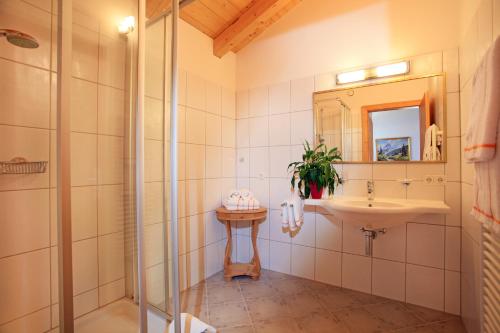 a bathroom with a sink and a shower at Chalet Isabella in Westendorf