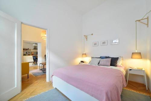 Postel nebo postele na pokoji v ubytování Hygge Apartment