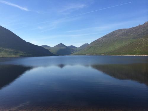 a view of a lake with mountains in the background at Greencastle in Kilkeel