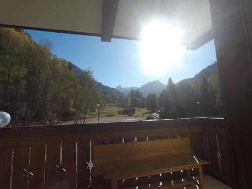 a balcony with a bench and a view of a mountain at cimes d'or in Les Contamines-Montjoie