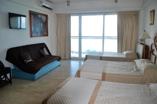 Una cama o camas en una habitación de Salvia Condominio