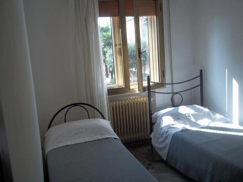 Кровать или кровати в номере Appartamento Gronda Lagunare