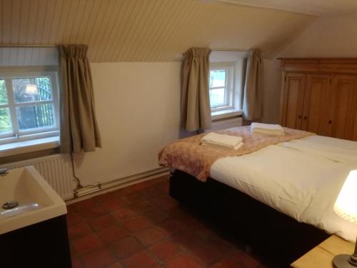 Een bed of bedden in een kamer bij Vakantiehuis Ganderhoeve
