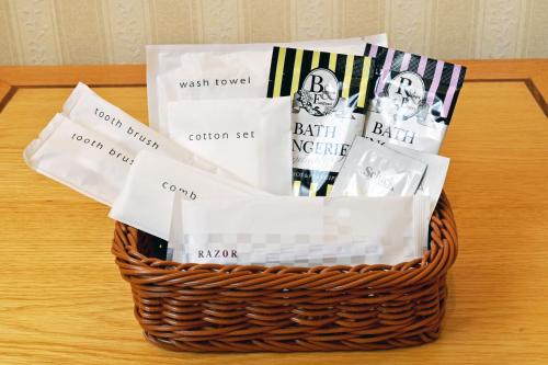 a basket filled with books and magazines on a table at Hotel Sapporo Sun Plaza in Sapporo