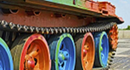 a close up of a toy train with colorful wheels at New Pacific Hotel in Ho Chi Minh City