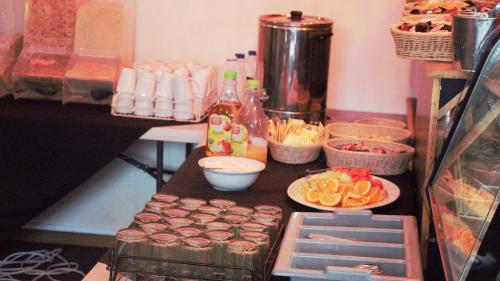 a kitchen with a counter with food on a table at Alpine Retreat Mt Buller in Mount Buller
