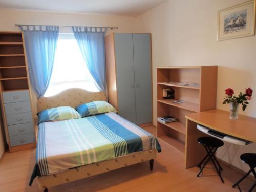 Postel nebo postele na pokoji v ubytování Apartment Sara