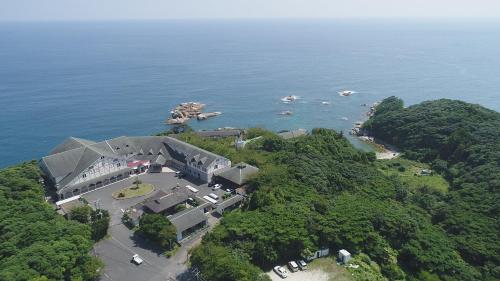 an aerial view of a building on a island in the water at Tsushima Grand Hotel in Tsushima